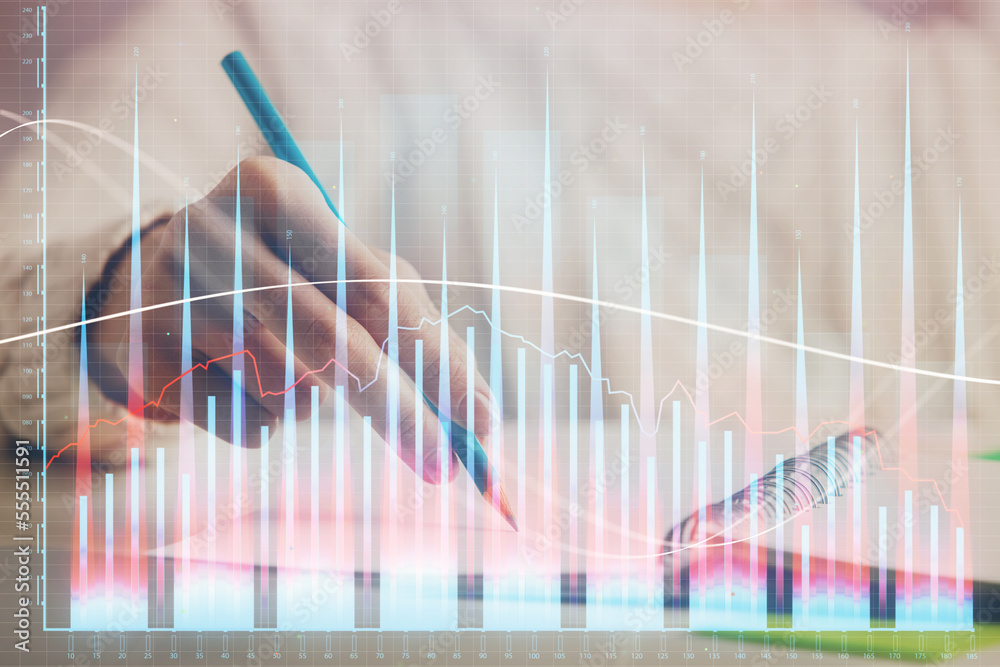 Financial forex graph displayed on hands taking notes background. Concept of research. Double exposure Financial forex graph displayed on hands taking notes background. Concept of research. Double exposure