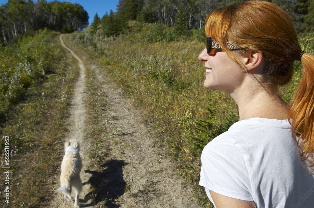 Woman Hiking With Her Dog Woman Hiking With Her Dog