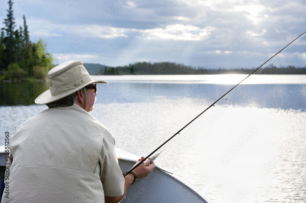 Man Fishing, Otter Lake, Missinipe, Saskatchewan, Canada Man Fishing, Otter Lake, Missinipe, Saskatchewan, Canada