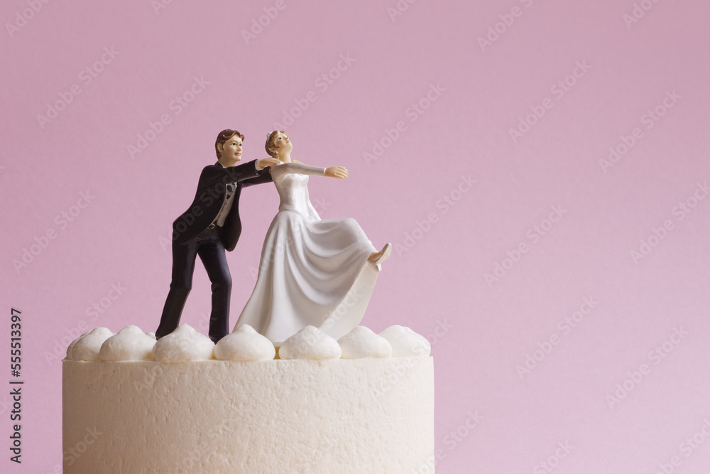 Wedding Cake Figurines, Groom Grabbing Runaway Bride Stock Photo ...