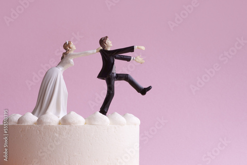 Wedding Cake Figurines, Bride Grabbing Runaway Groom photo