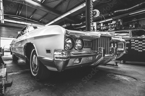 A vintage 1970ies Ford LTD Brougham in a classic car work shop photo