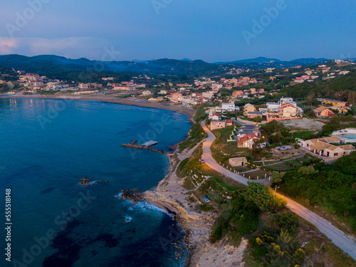 Aerial drone view of Agios Stefanos beach, a small tourist resort on the north east coast of Corfu in Greece   © ernestos