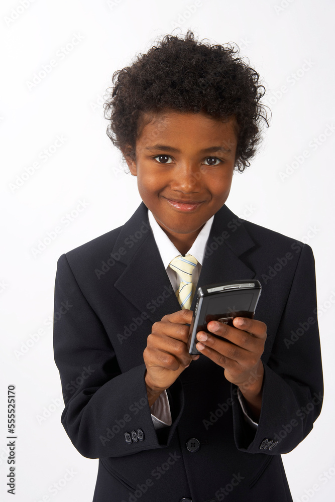 Little Boy Dressed Up as a Businessman Using Cell Phone Little Boy Dressed Up as a Businessman Using Cell Phone