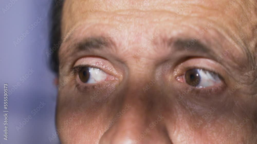 Close-up criminal or cunning male eyes.
Close-up of male eyes wandering, alert or guilty male eyes.
