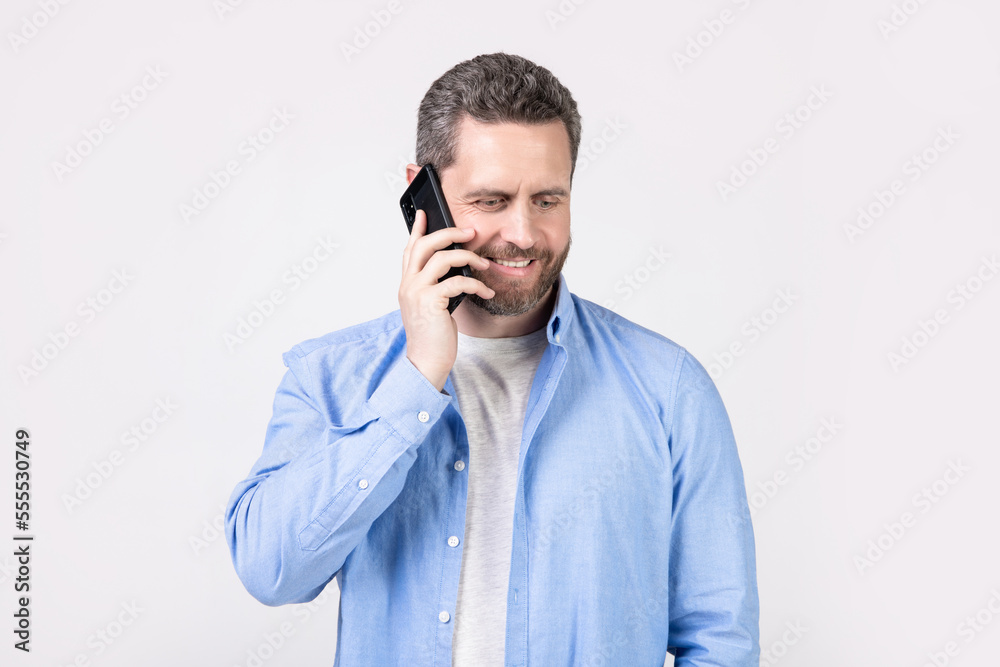 photo of cheerful man having communication call. man has communication call on phone photo of cheerful man having communication call. man has communication call on phone