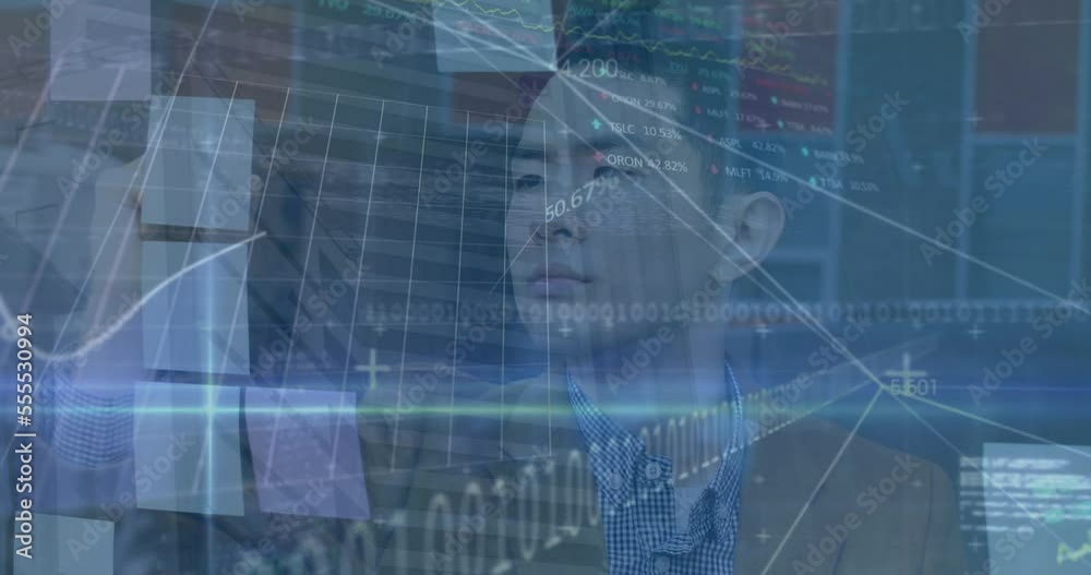 Animation of data processing over asian businessman in office Animation of data processing over asian businessman in office