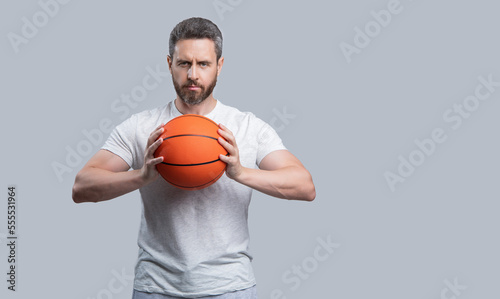 photo of professional athlete basketball player with ball. athlete basketball player in sportswear.