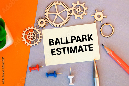 Business concept. open notepad with text on calendar - BALLPARK ESTIMATE