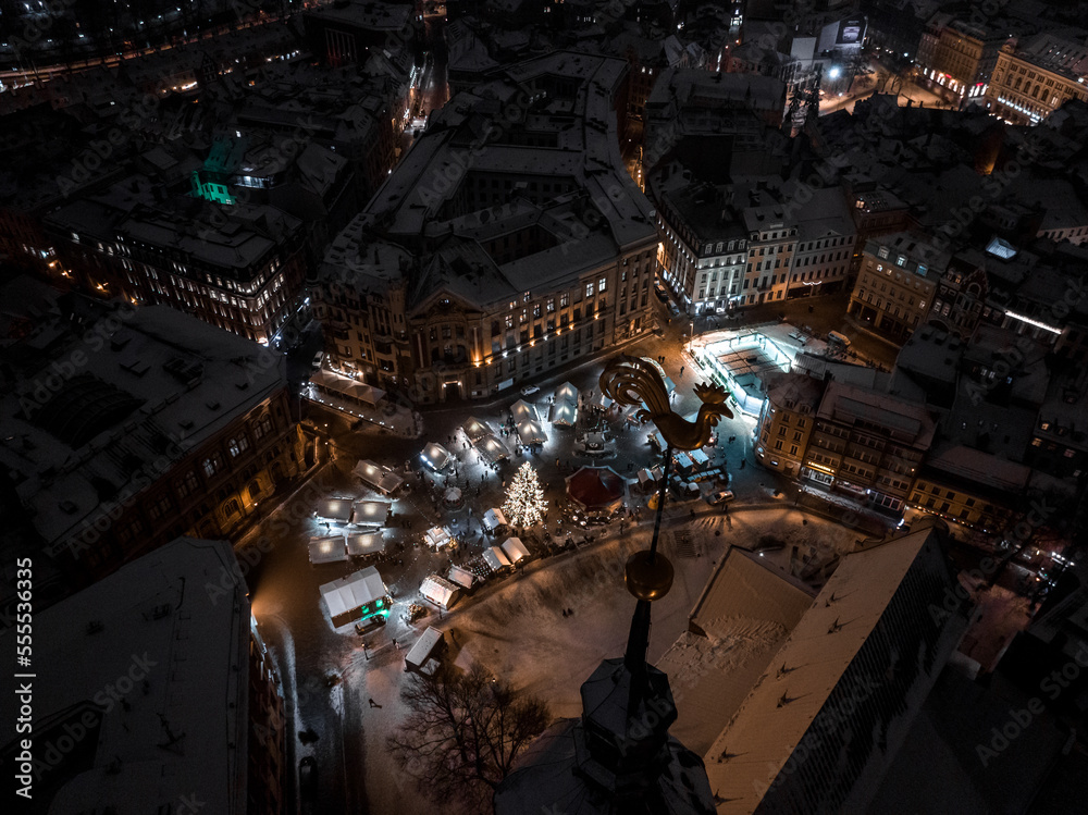 Obraz premium Aerial night view of the winter Riga old town - the capital of Latvia. Beautiful winter over Riga.