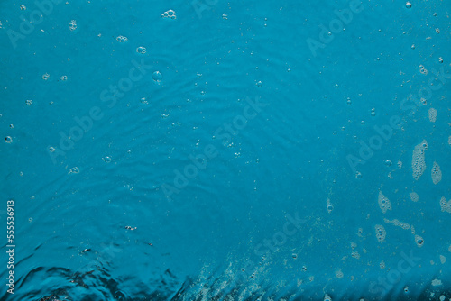 Water with bubbles on color background
