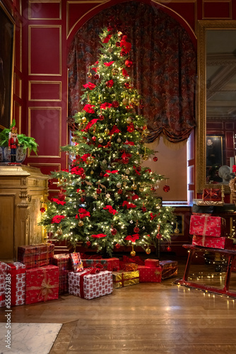 Lovely Christmas Tree and Gift Boxes with Nutcracker in a Cosy Room