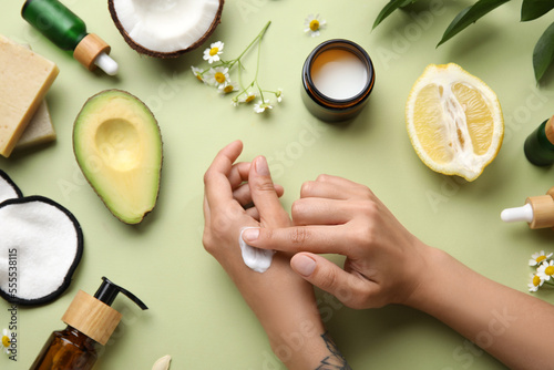 Woman applying natural crea...
