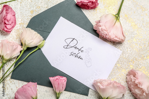 Card with text DANKE SCHON and beautiful eustoma flowers on light background, closeup photo