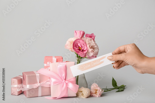Female hand with card, gift...