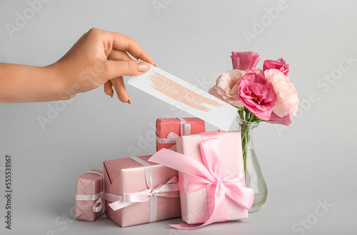 Female hand with card, gift...