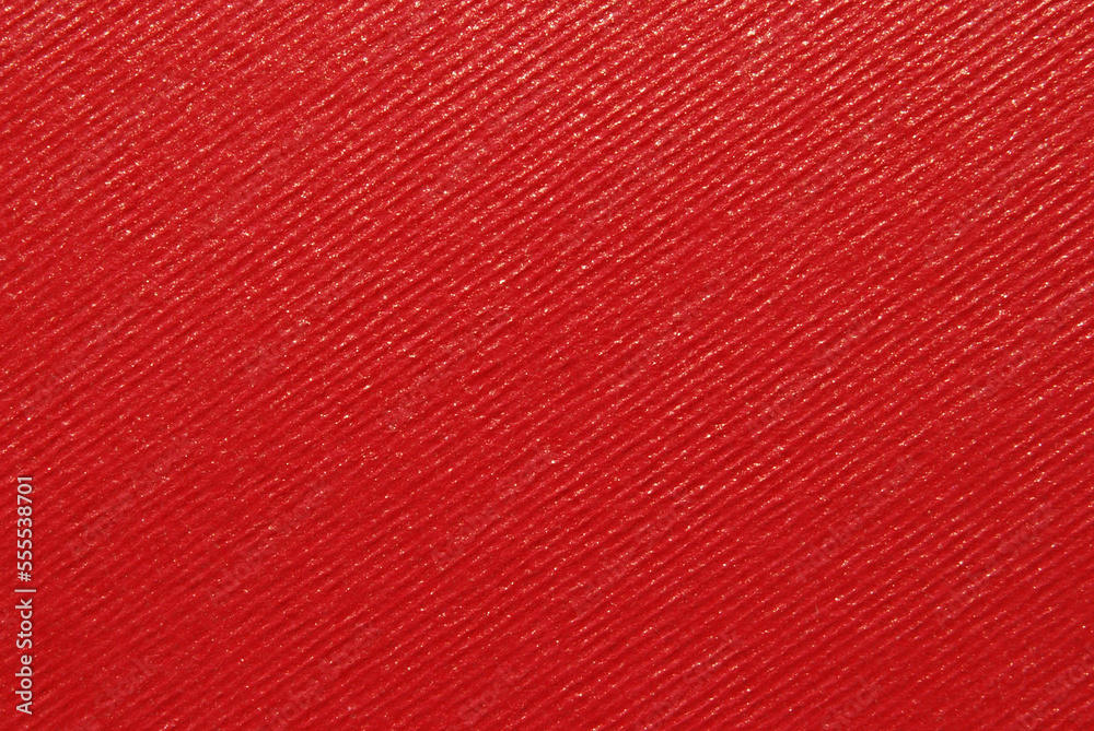 Fototapeta premium Red ribbed colored craft paper texture with golden glitter effect 