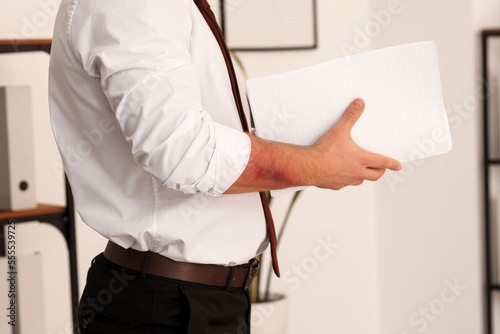 Man with bruise on arm in office