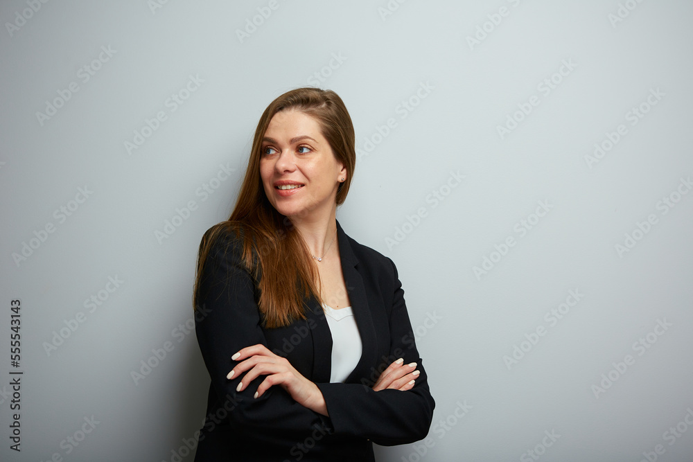 Smiling business woman crossed arms, looking back over shoulder. isolated portrait. Smiling business woman crossed arms, looking back over shoulder. isolated portrait.
