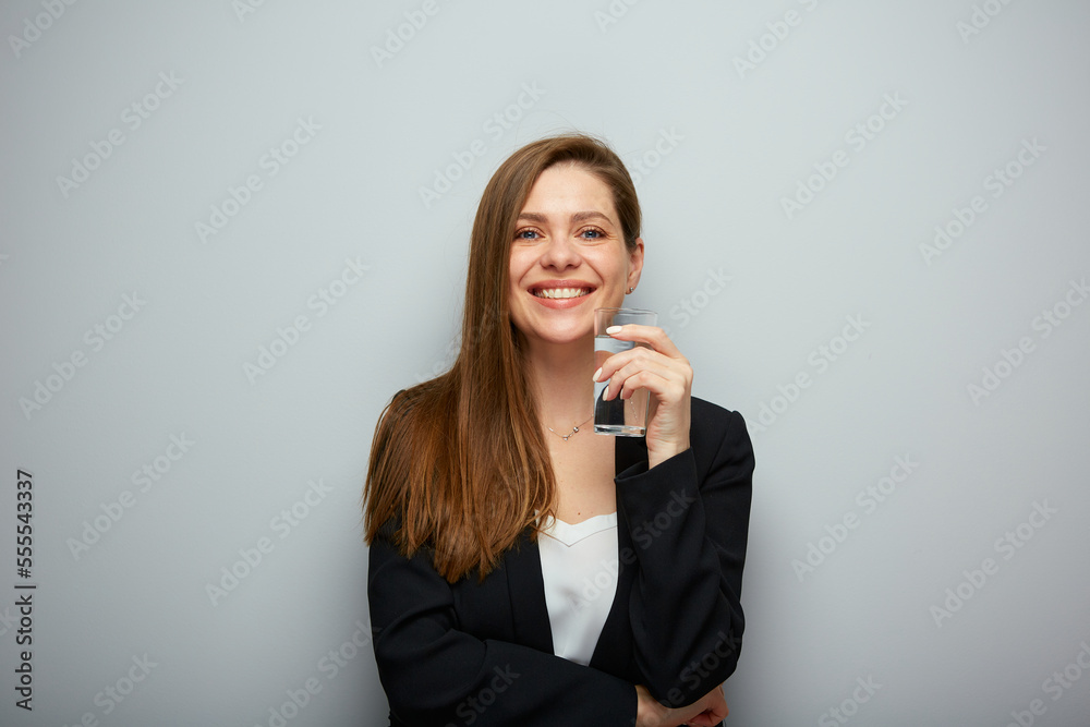 Smiling woman holding water glass. isolated female portrait with black suit. Smiling woman holding water glass. isolated female portrait with black suit.