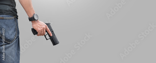 Bild auf Leinwand Isolated 9mm pistol gun holding in right hand of gun shooter with clipping paths, copy space