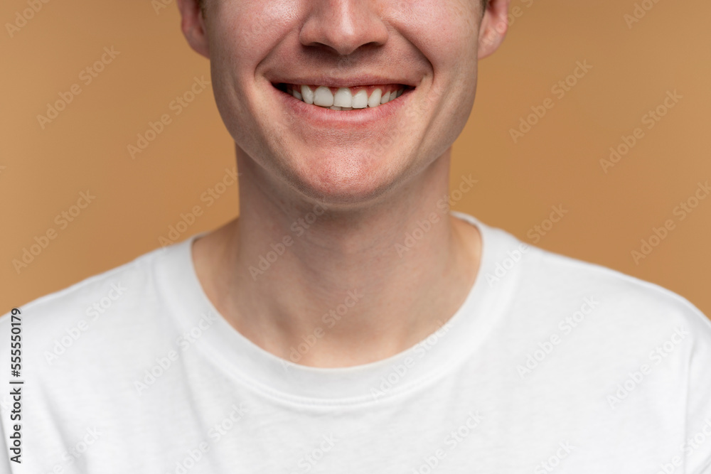 Cropped view of happy cheerful man smiling toothy with closed eyes Cropped view of happy cheerful man smiling toothy with closed eyes
