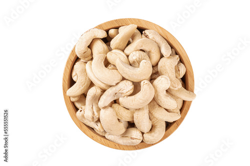 Cashew nuts in wooden bowl isolated on white