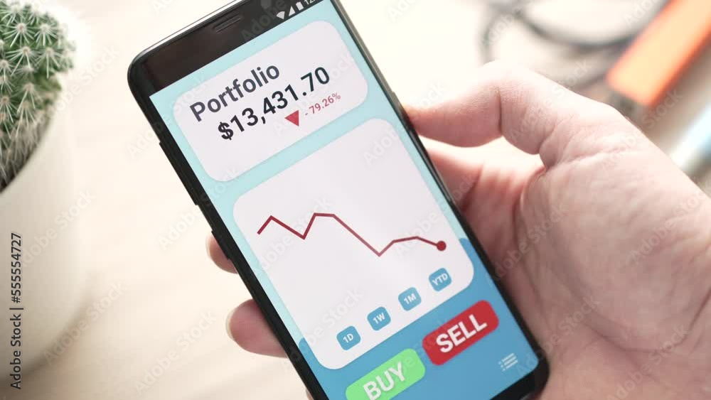 Stock Market Portfolio Going Down With Red Graph on Smartphone app Stock Market Portfolio Going Down With Red Graph on Smartphone app