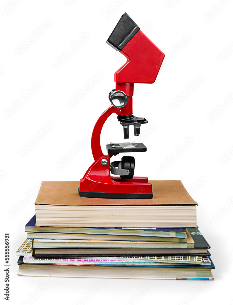 The modern red microscope on a Stack of Books The modern red microscope on a Stack of Books