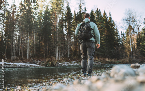 man walking in forest