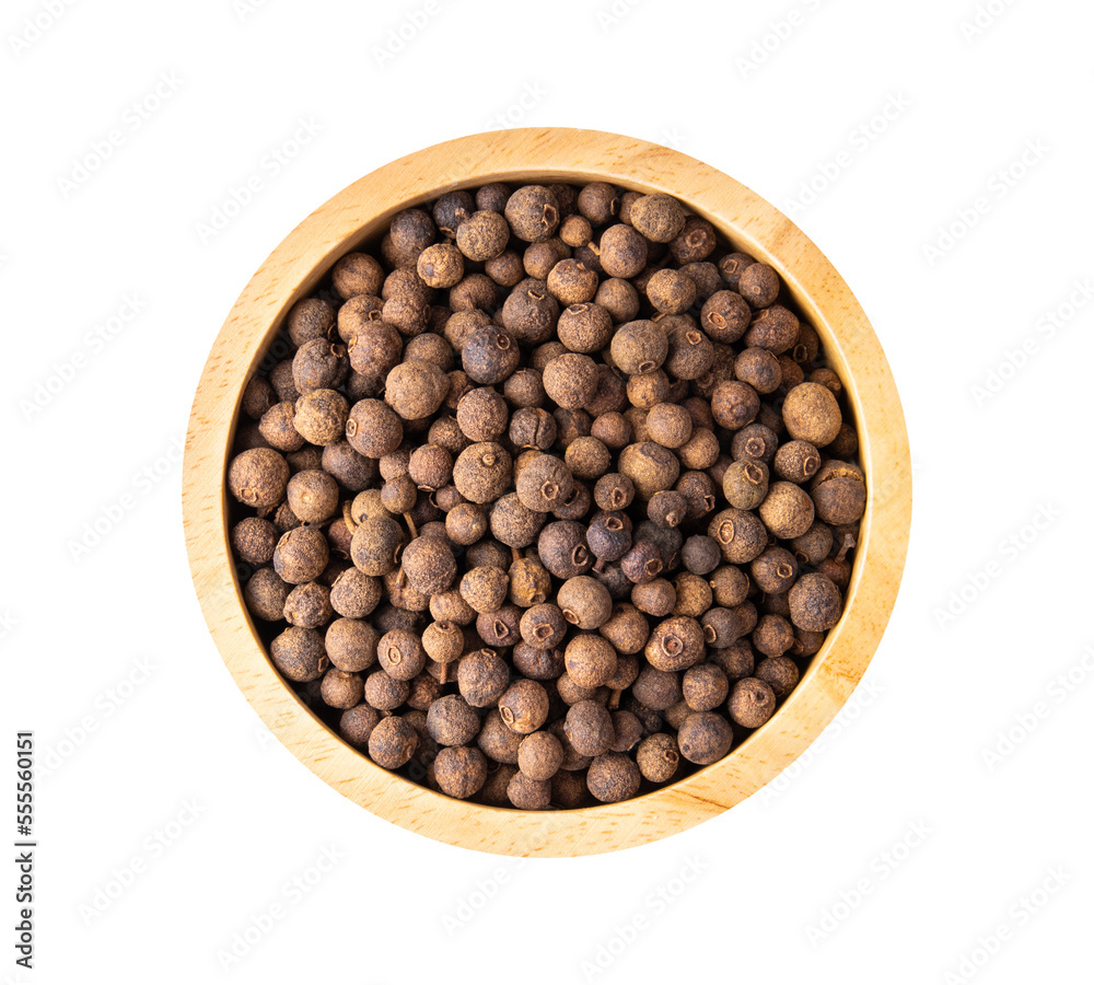 Allspice berries (also called Jamaican pepper or newspice) in wood bowl on white background. top view Allspice berries (also called Jamaican pepper or newspice) in wood bowl on white background. top view