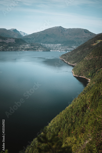 Mountains during moody weather in autumn Norway with a fjord and beautiful reflections Background
