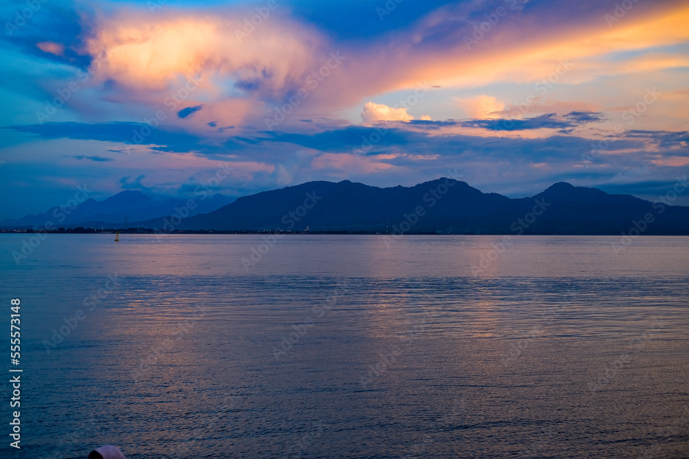 sunset on Dermaga Cinta Beach, Banyuwangi. Sunset with view of Bali Island. Sunset over the sea.