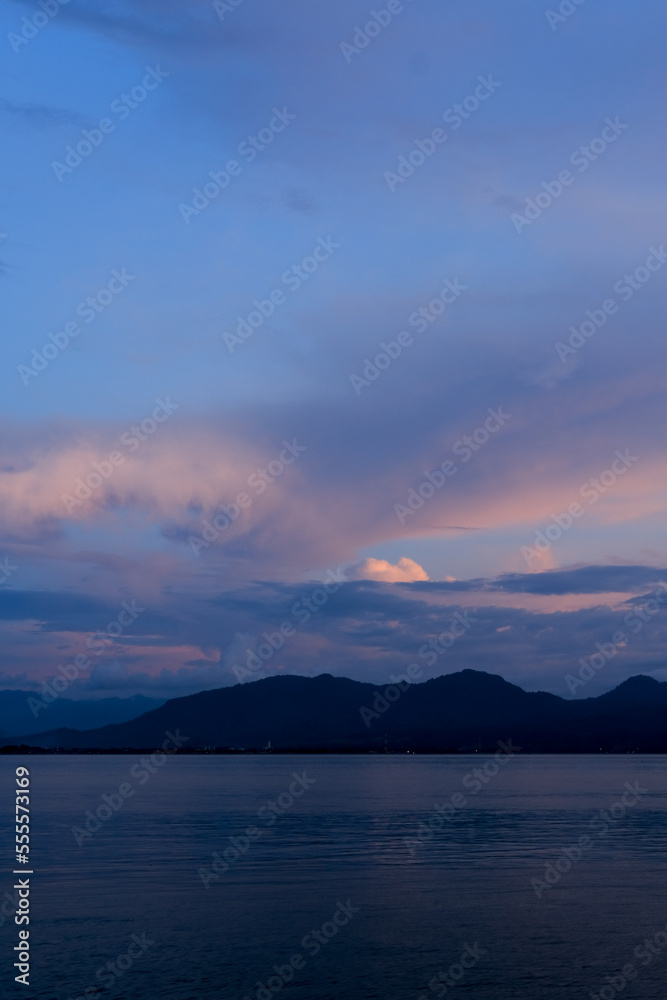 sunset on Dermaga Cinta Beach, Banyuwangi. Sunset with view of Bali Island. Sunset over the sea.