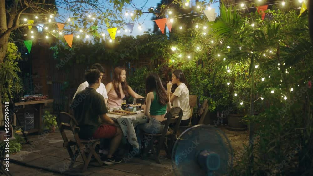 Asian people having a barbecue party and drinking beer. Asian people having a barbecue party and drinking beer.