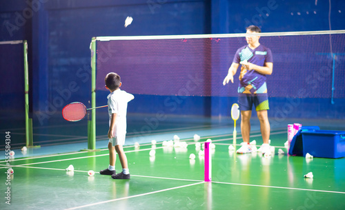 Boys training badminton indoor  activitiy