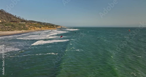 Davenport California Aerial v1 drone fly around waddell beach capturing post bushfire landscape with kite boarders surfing the wind, flying high in the sky - Shot with Mavic 3 Cine - May 2022 photo