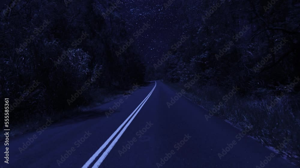 Rear facing night driving point of view POV for interior car scene green screen replacement - night footage under a clear starry sky, on quiet deserted country roads with a slight righthand bend