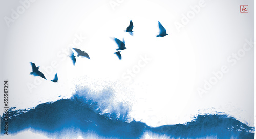 Ink wash painting with flock of birds over the sea wave. Traditional oriental ink painting sumi-e, u-sin, go-hua. Simple minimalist style. Translation of hieroglyph - eternity