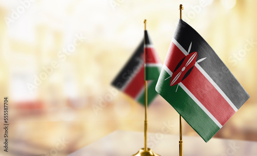 Small flags of the Kenya on an abstract blurry background