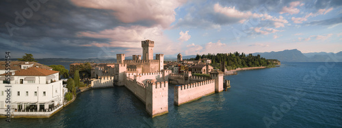Morning panorama of Scaligero Castle in Italy on lake garda aerial view. photo