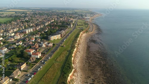 Wallpaper Mural High Aerial Drone Shot Flying Down the Line of Old Hunstanton Cliffs with Parallel Road and Sandy and Rocky Beach will Calm Sea Water with New Hunstanton in the Distance North Norfolk UK Torontodigital.ca