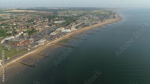 Wallpaper Mural High Establishing Aerial Drone Shot Flying Over Coastal Seaside Town New Hunstanton with Groynes along Sandy Beach and Ferris Wheel and Fun Fair with Calm Sea with Small Waves North Norfolk UK Torontodigital.ca