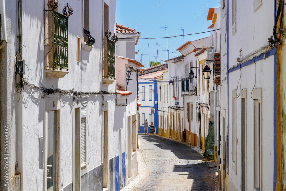 Narrow street with white houses in village of Villa Viçosa, Alentejo, Portugal