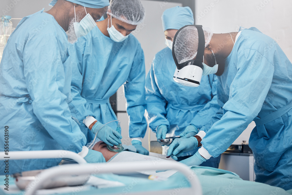 Doctors, surgery and collaboration with a medicine team in scrubs operating on a man patient in a hospital. Doctor, nurse and teamwork with a medical group in a clinic to perform an operation Doctors, surgery and collaboration with a medicine team in scrubs operating on a man patient in a hospital. Doctor, nurse and teamwork with a medical group in a clinic to perform an operation