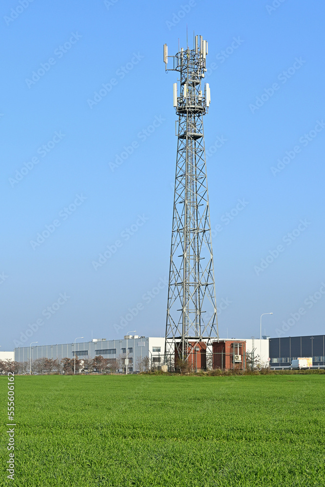 Industrial area with telecommunications tower carrying antennas of cellular networks in the Czech Republic Industrial area with telecommunications tower carrying antennas of cellular networks in the Czech Republic