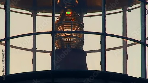 Light chamber and lamp of the lighthouse of Snake Island in the backlight of the setting sun. Black Sea, Ukraine. photo