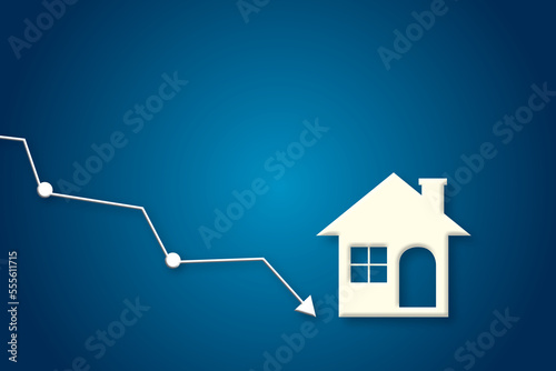 White paper houses with arrow down on blue background. Concept for low cost real estate. Lower mortgage interest rates. Falling prices of rental housing. Reducing demand of home buying. paper cut.