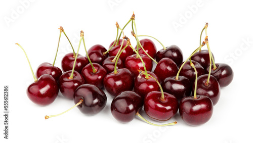 A bunch of ripe cherries on a red background, organic fruits.