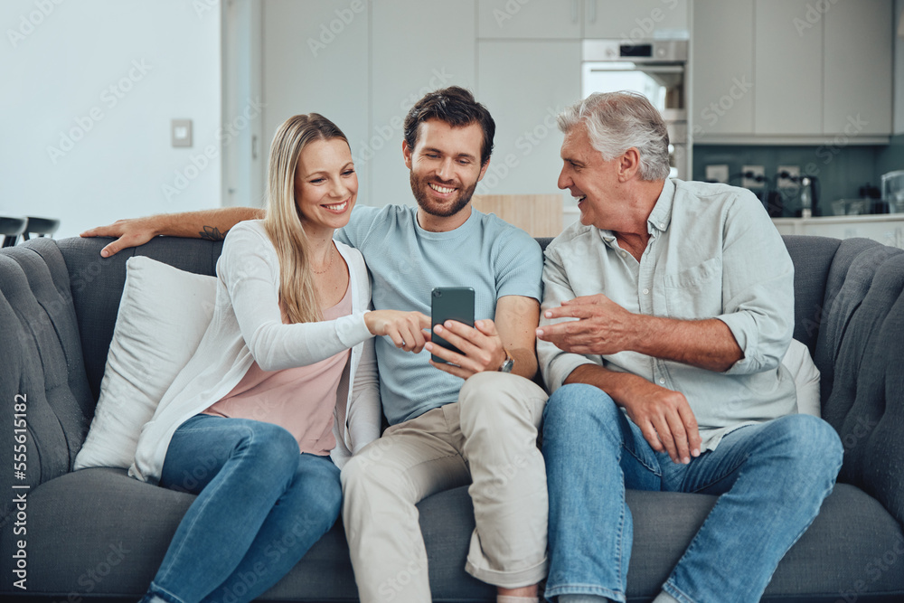 Relax, search and phone with family on sofa for share internet, social media or online news. Care, retirement and help grandfather with man and woman in living room for technology, digital or contact Relax, search and phone with family on sofa for share internet, social media or online news. Care, retirement and help grandfather with man and woman in living room for technology, digital or contact